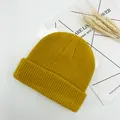 Detail of ginger yellow knitted beanie with ribbed texture and cuffed design - One Size (Elastic Adjustable) / Yellow