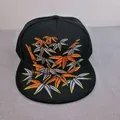 Black flat brim baseball cap with orange and yellow embroidered bamboo leaf patterns - Bamboo Leaf Embroidery (Black)