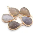 Set of five faceted grey translucent teardrop stone pendants with gold metal edging - Grey Agate