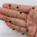 Golden chain necklace featuring faceted black crystals and twisted metal bars on a hand - 4mm / Black (No.2)