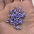 Silver rice chain with lavender purple beads held in hand for jewelry DIY craft - Lavender