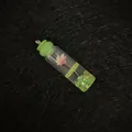 Miniature glass bottle pendant with pink dried flower and bright green liquid fill - Light Green Cap (No.5)