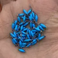 Blue rice-shaped beads on a silver stainless steel chain held in a palm for scale - Bright Blue
