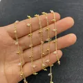 Gouden koperen ketting met roze doorschijnende kralen voor DIY sieraden maken - Op Rol