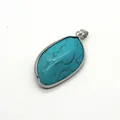Macro detail of blue turquoise stone pendant with silver metallic wavy frame - Silver Edged (No. 2) / 22x40mm