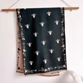 Detail of vintage jacquard scarf showing green bee pattern and soft fringe edges - 18.5cm / Black