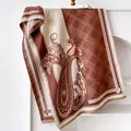 Detailed view of paisley and plaid pattern pashmina scarf with elegant fringe trim - 185cm / Dark Brown