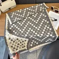 Close-up of heart-patterned thick cashmere-like shawl with fine fringe details - Gray