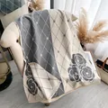 Grey and white cashmere-feel scarf featuring camellia floral patterns and elegant tassels - Gray