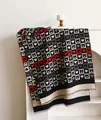 Black and beige checkerboard scarf with bear and heart patterns and fringe edges - Black