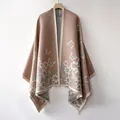 Detail of light camel shawl featuring butterfly patterns and elegant fringe trim texture - Butterfly-Khaki