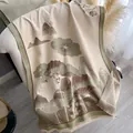 Detail of floral jacquard scarf with fringe trim draped elegantly on a sofa - Green