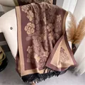 Macro detail of camellia pattern jacquard fabric and black tassel fringe on shawl - 180cm / Coffee