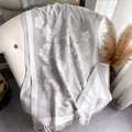 Gray camellia pattern cashmere-like scarf with white fringe on a tufted chair - 180cm / Silver Gray