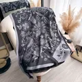 Detail of floral pattern on dual-sided cotton scarf with elegant fringe trim finish - TSM-211 / 180x70cm / Black