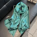 Detail of dark green silk scarf with metallic shimmer and subtle floral textures - Tsm-079 Green