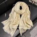 Elegant champagne silk-feel scarf with floral jacquard pattern and fringe trim - Beige
