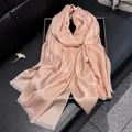 Elegant light pink silk scarf with shimmering gold silk thread and fringe details - Pink