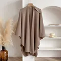 Elegant tan knitted cape shawl wrap with a soft drape and natural wavy edges - Khaki