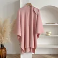 Pale pink knitted shawl poncho for women with elegant bow detail on the shoulder - Pink