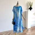 Sky blue and white abstract print loose satin dress with elegant boat neck and batwing sleeves - Blue