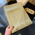 Elegant sage green shimmering silk scarf with delicate tassels for a luxury fashion look - Matcha Green