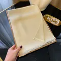 Elegant champagne gold silk scarf with shimmering metallic threads and fringe trim - Beige