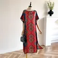 Long bohemian kaftan dress with orange and blue geometric patterns on light fabric - Red