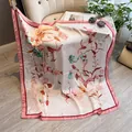 Floral satin silk square scarf in pink with elegant lily print draped on a chair - 90sj-059 Pink / 90*90cm