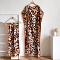 Detail of silk-like leopard print kaftan gown and matching scarf with satin trim - Khaki Leopard