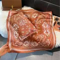 Caramel orange paisley silk-feel square scarf with geometric border and elegant gloss - Brown