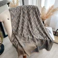 Ethnic Ikat pattern knitted shawl in grey and gold brown with decorative tassels - 185x65 / Gray