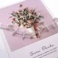Polished palm-shaped white freshwater shell beads for jewelry making on floral card - Small
