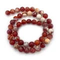 Macro detail of natural fire dragon vein agate beads with polished texture and red patterns - 6mm / Red (No.1)