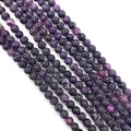 Macrodetail van natuurlijke drakenaderagaatkralen met paars netpatroon voor DIY-sieraden - Zwart Roze Crackle