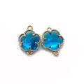 Connettore a fiore in pietra blu pavone con bordo dorato per creazione gioielli DIY - Taglia 3 / 11x15 Mm (50 Pezzi/confezione)