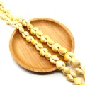 Natural cowrie shell beads in cream and yellow for DIY bohemian jewelry making - Style 1 (ai-Rice White)