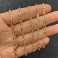 Cadena de eslabones ovales dorados con textura sostenida en la mano para detalles - Estilo ovalado largo texturizado (N.º 1 3x7mm)