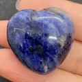 Polished heart-shaped blue lapis lazuli natural stone bead held in palm for DIY jewelry - 30x30mm, 14mm Thickness / Deep Blue Stone (11)