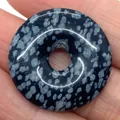 Polished snowflake obsidian donut pendant stone with unique white speckled patterns - Snowflake Obsidian