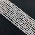 Natural white freshwater rice pearls strands for DIY jewelry making on black background - 2-3mm / White