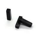 Close-up of three polished black onyx rectangular stone pendants with pre-drilled holes - 7-26mm 3g / Black Agate