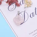 Polished cushion-cut pink quartz pendant with silver bail on decorative background - Rose Quartz (24x28mm) / Rose Quartz