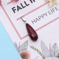 Faceted teardrop red jasper stone pendant with silver clasp on artistic background - Red Agate Style (1)