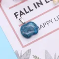 Apple-shaped natural blue stone pendant with marble texture and silver clasp on a card - Blue Marble Texture(3)