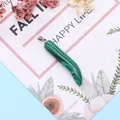 Malachite stone chili shaped pendant with silver bail on decorative display card - 8x42mm / Malachite