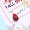 Deep red faceted teardrop gemstone pendant with silver metal clasp on decorative card - 13x23mm / Red Jasper