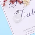 Square white translucent natural stone pendant with silver clasp on a floral card - 24x28mm / White Crystal