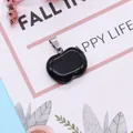 Polished apple-shaped black gemstone pendant with silver metal clasp on a decorative card - Black Agate