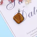 Rhombus tiger eye stone pendant with silver metal clasp on an elegant floral background - 24x28mm / Tiger's Eye